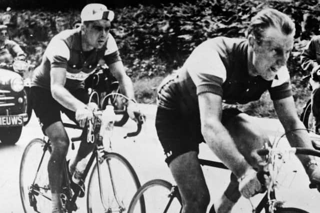 PIONEER: Brian Robinson (right) leading fellow competitors Andre Darrigade of France (centre) and Swiss Fritz Schaer, near the end of the first stage of 138 miles from Rheims to Liege of the Tour de France back in July 1956 Picture: PA