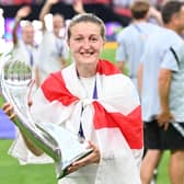 England striker Ellen White poses with the Euro 2022 trophy as England's players celebrate after their win in the UEFA Women's Euro 2022 final. Picture: JUSTIN TALLIS/AFP via Getty Images.