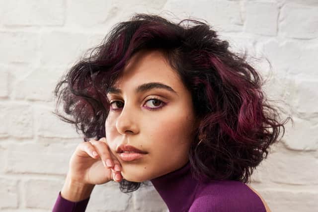 Purple panel placed on hair working with natural movement, a style from the Wella Signature Naturals collection created by Robert Eaton, creative director at Russell Eaton salons in Leeds and Barnsley.