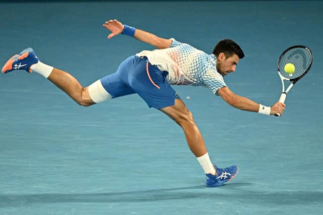 Looking unbeatable: Serbia's Novak Djokovic hits a return against Australia's Alex De Minaur during his thumping fourth-round win (Picture: ANTHONY WALLACE/AFP via Getty Images)