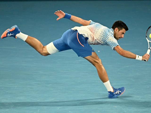 Looking unbeatable: Serbia's Novak Djokovic hits a return against Australia's Alex De Minaur during his thumping fourth-round win (Picture: ANTHONY WALLACE/AFP via Getty Images)