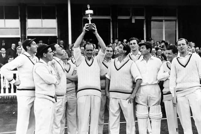 WINNER: Yorkshire captain Brian Close holds the Gillette Cup trophy cup aloft watched by his victorious team having beaten Surrey in the 1965 final at Lord's.