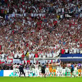 England players line arms as the England fans sing and celebrate following victory in the FIFA World Cup 2026 quarter-final match at the Miami Stadium. PIC: Bradley Collyer/PA Wire.