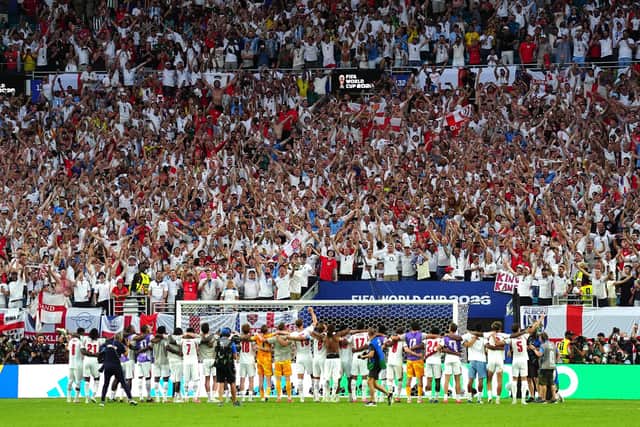 England players line arms as the England fans sing and celebrate following victory in the FIFA World Cup 2026 quarter-final match at the Miami Stadium. PIC: Bradley Collyer/PA Wire.