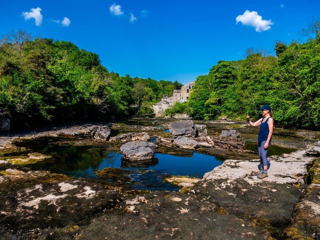 A visitor to Yorkshire Lesley Kimber, captures this dramatic scene from the middle of Aysgarth Falls, near Leyburn, North Yorkshire. These famous falls, once visited by Wordsworth and sketched by Turner, and used in Robin Hood: Prince of Thieves, are now almost dry due to low spring rainfall. Picture: James Hardisty.
