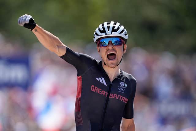 MAGIC MOMENT: Tom Pidcock crosses the line to win gold during the Men's Cross-country mountain bike at Elancourt Hill, Paris. Picture: Martin Rickett/PA