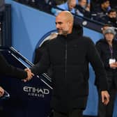 MANCHESTER, ENGLAND - JANUARY 27: Mikel Arteta, Manager of Arsenal, shakes hands with Pep Guardiola, Manager of Manchester City, prior to the Emirates FA Cup Fourth Round match between Manchester City and Arsenal at Etihad Stadium on January 27, 2023 in Manchester, England. (Photo by Michael Regan/Getty Images)
