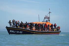 A group of people thought to be migrants are brought in to Dungeness, Kent, onboard an RNLI Dungeness Lifeboat, following a small boat incident in the Channel. PIC: Jordan Pettitt/PA Wire