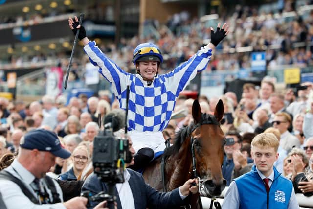 Saffie Osborne celebrates after winning the Betfred St Leger Stakes on day three of the Betfred St Leger Festival at Doncaster Racecourse.
