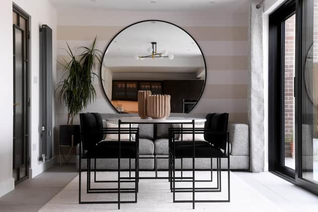 The mirror, dining table and chairs by iSteel