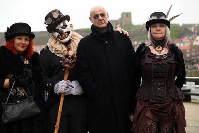 Participants in costume pose for a photo while attending the biannual Whitby Goth Weekend