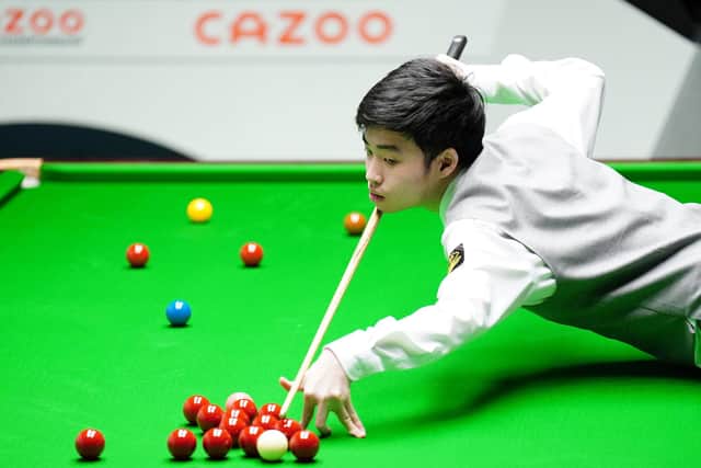 ATTACK-MINDED: Si Jiahui in action against Anthony McGill (not pictured) on day twelve of the World Snooker Championship at the Crucible Theatre. Picture: Zac Goodwin/PA