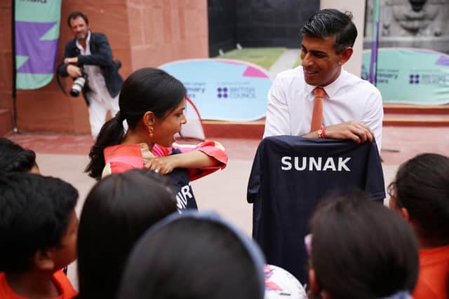 Prime Minister Rishi Sunak and his wife Akshata Murty meet local schoolchildren at the British Council during an official visit ahead of the G20 Summit in New Delhi, India. PIC: Dan Kitwood/PA Wire