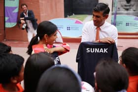 Prime Minister Rishi Sunak and his wife Akshata Murty meet local schoolchildren at the British Council during an official visit ahead of the G20 Summit in New Delhi, India. PIC: Dan Kitwood/PA Wire