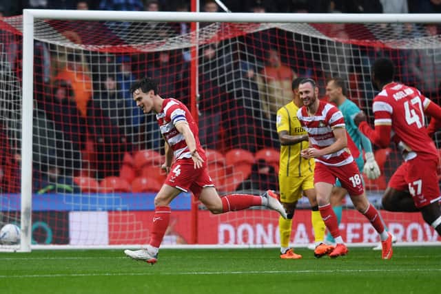 Doncaster Rovers' Owen Bailey celebrates opening the scoring against Sheffield Wednesday. Picture: Jonathan Gawthorpe