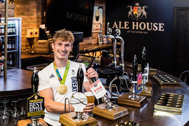 Jack Laugher pours one of the first pints at the newly refurbished Ripon Inn in Ripon, North Yorkshire. Photograph: Stuart Boulton/The Inn Company