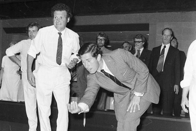 Gordon Thompson looks on as the Prince tries his hand at bowling on Sunderland Leisure Centre's indoor green 44 years ago.