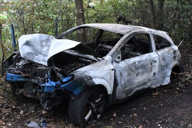 Carey's car was totally destroyed after it burst into flames when he crashed it in a wooded area. Credit: NYP
