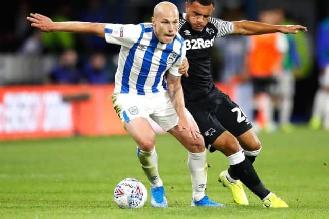 Aaron Mooy in one of his final games for Huddersfield Town.