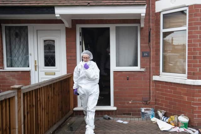 Forensics officers at the scene of a fire at a house on Wensley Avenue, Hull, where two people died on Saturday. Danny Lawson/PA Wire