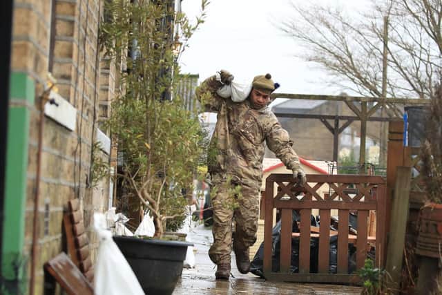 A soldier from The Highlanders, 4th Battalion, the Royal Regiment of Scotland in Mytholmroyd assisting with flood defences, in the Upper Calder Valley in West Yorkshire ahead of Storm Dennis. Picture: Danny Lawson/PA Wire