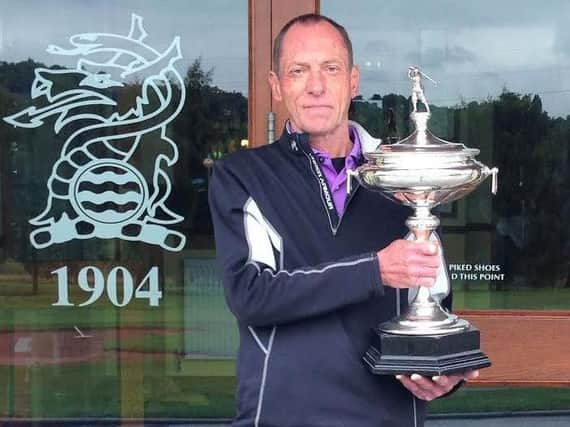 Keighley club champion Martin Cooper gets his hands on the trophy for the third time - 40 years on from his previous success in the event.
