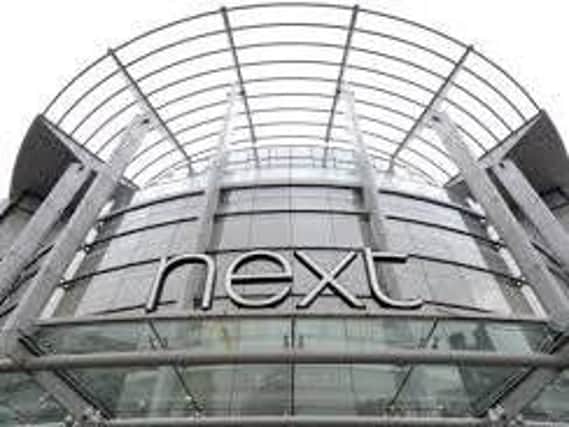 Next said the warm September has not helped trading in its stores
