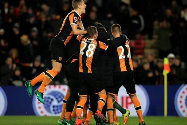 The Hull squad celebrate following Newcastle's third missed penalty (Photo: PA)
