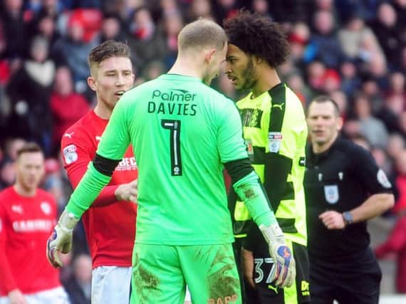 Adam Davies and Izzy Brown share a word with each other during the clash