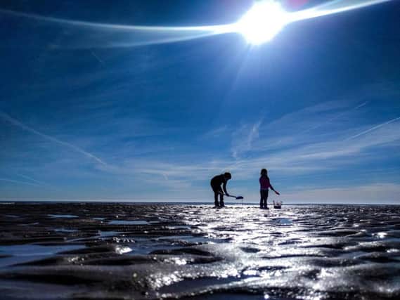 Oliver, 8, and Freya, 3, Hardisty, have fun in the sun on the South Shore beach at Bridlington, East Yorkshire.