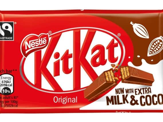 New packaging for KitKat which will contain extra milk and extra cocoa from this week as the company continues efforts to reduce sugar.