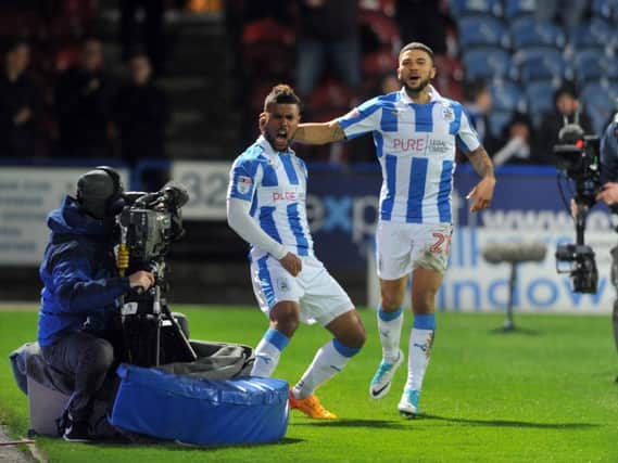 Elias Kachunga celebrates with Nahki Wells during Huddersfield's 3-0 win over Norwich