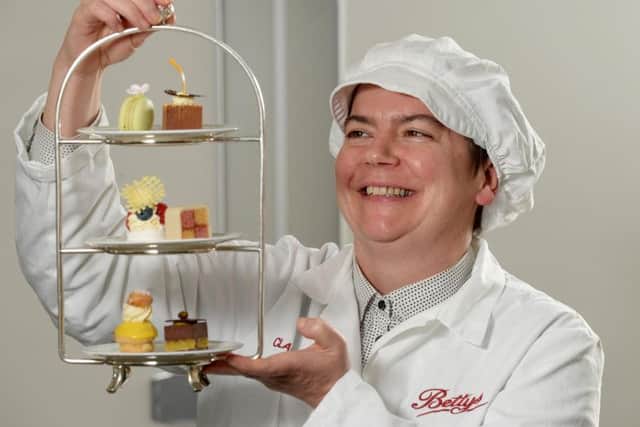 Claire Gallagher who is in charge of developing all the new ranges at Bettys with a Selection Betty's Cakes for Afternoon Tea.