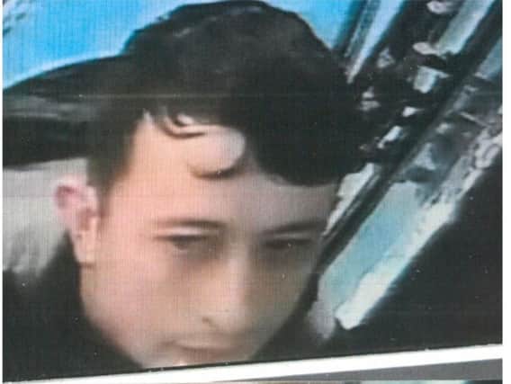 A CCTV image released by police of a man they want to speak to in connection with the robbery.