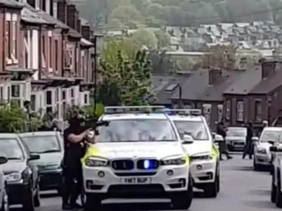 Armed officers made arrests in Sheffield as part of a police probe into armed robberies in Leeds