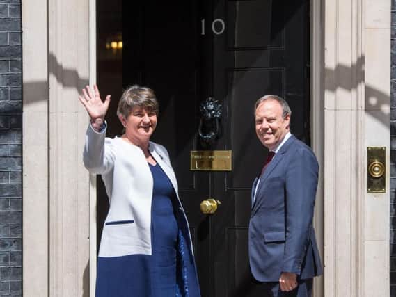 DUP leader Arlene Foster and DUP deputy leader Nigel Dodds arriving at 10 Downing Street in London for talks on a deal to prop up a Tory minority administration. Picture: Dominic Lipinski/PA Wire