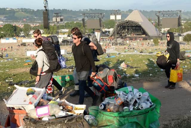 Rubbish is collected following the Glastonbury Festival at Worthy Farm in Pilton, Somerset.