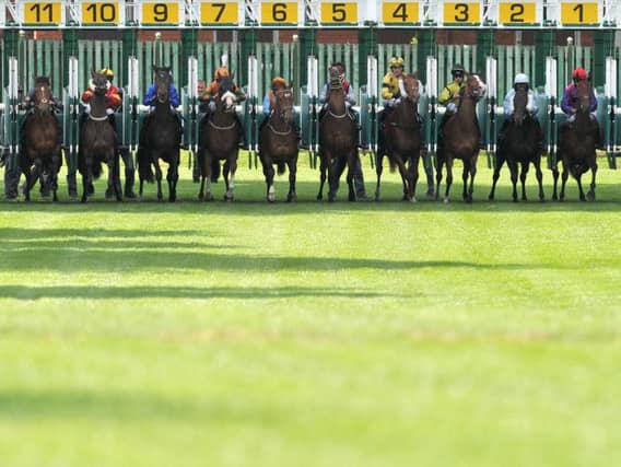 Jockeys leave the stalls at Haydock Park