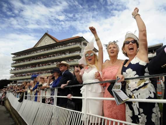 Ladies cheer on Ullysses the winner of the Juddmonte International Stakes. Picture by Simon Hulme