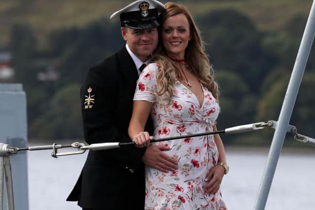 Petty Officer (Mine Warfare) Mark Titman with Laura Campbell after proposing to her as Crew 1, who have spent the last seven and a half months operating the HMS Penzance, returns to HM Naval Base Clyde after three years on deployment in the Gulf. PA