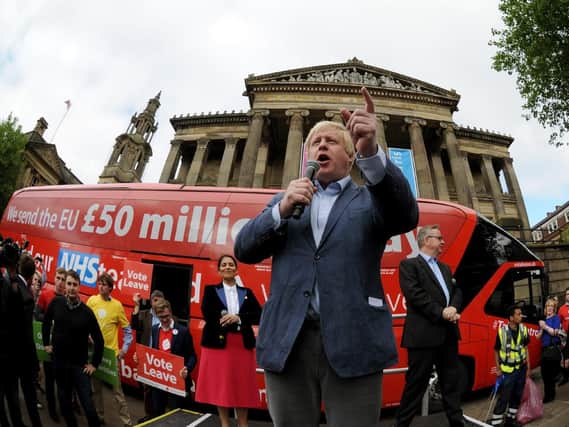 Boris Johnson in front of the bus that became the centre of attention during EU referendum campaigning. PA