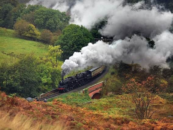 The Festival of Steam comes to North Yorkshire. A steam locomotive races through the Goathland countryside. Picture: Richard Ponter