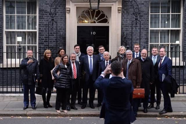 Business leaders from Europe and the UK pose for a group photo as they leave 10 Downing Street, London, after a meeting with Prime Minister Theresa May to discuss the future of UK-EU trade post-Brexit. Picture: Stefan Rousseau/PA Wire