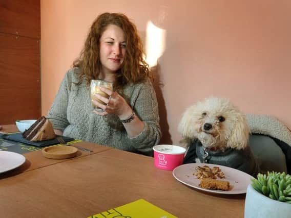 Dog owner Kelly Moss and pet Ruby enjoy a meal in the Kibble Bakery