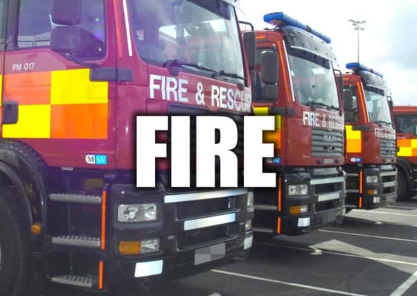 A woman suffered smoke inhalation at a fire in Brighouse this morning.