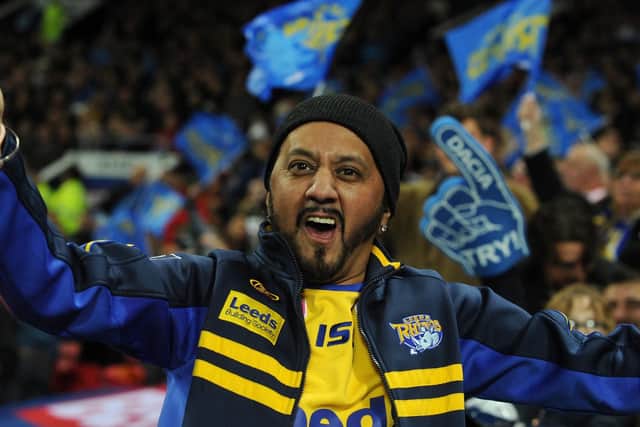 A Leeds fan celebrates during the Grand Final.
