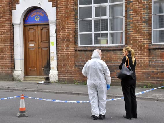 Police investigate the damage