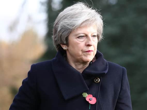 Prime Minister Theresa May at the St Symphorien Military Cemetery in Mons where she is laying wreaths at the graves of the first and last British soldiers to be killed in the First World War.