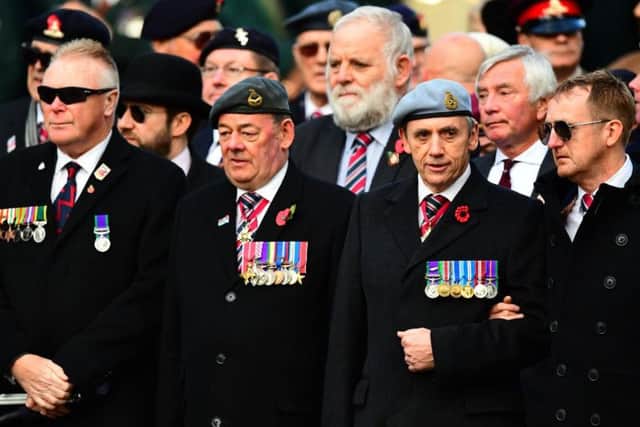 Military veterans attend the remembrance service at the Cenotaph memorial in Whitehall, central London, on the 100th anniversary of the signing of the Armistice which marked the end of the First World War.
