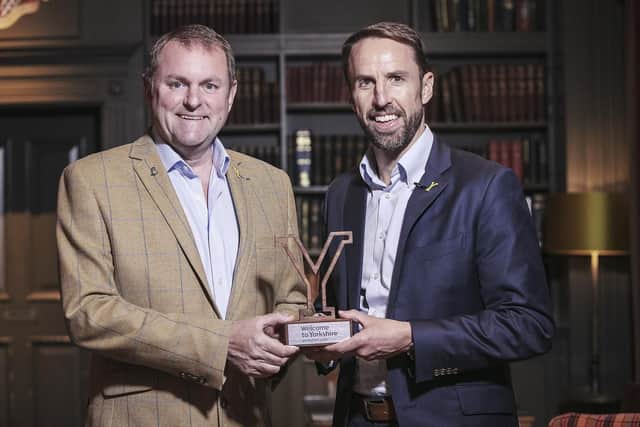 Chief executive of Welcome to Yorkshire, Sir Gary Verity presents Gareth Southgate with his award